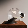 Modern Transparent Globe Table Lamp With Black Base And Metal Ball Decor