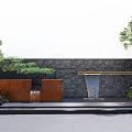 Black Stone Landscape Wall Featuring Flowing Water Green Plants And Rusted Steel Accents