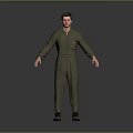 Man in Green Overalls Standing with Hands Naturally Hanging Down on Gray Background