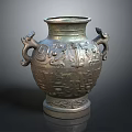 Ancient Bronze Vase With Animal Head Handles And Intricate Carved Patterns
