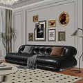 Black Leather Sectional Sofa With Decorative Pillows Throw Blanket Wall Art Frames And Floor Lamp In Living Room