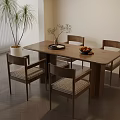 Modern Wooden Dining Table Set With Four Chairs Woven Seats And Fruits On Tray