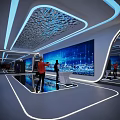 Person Standing Before Large Digital Screen With Blue City Night View And Network Lines