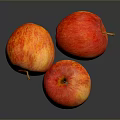 Three Fresh Juicy Red Apples With Vibrant Color And Shiny Skin On Dark Reflective Surface