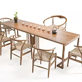 Minimalist Wooden Tea Table and Chairs with Teacups Teapot and Small Plant
