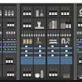 Modern Wine Cabinet With Glass Doors Displaying Wine Bottles Glasses Decorative Items And Blue Drawers