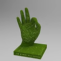 Green Granular OK Hand Gesture Sculpture Composed of Small Particles With Square Base