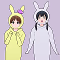 Two Cartoon Girls In Rabbit Costumes Yellow With Pink Bow And White Outfits