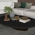 Decorative Ornaments Set on Modern Glass Coffee Table with Green Plant Silver Vase Gold Tray