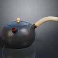 Black Teapot With Light Colored Handle Red Spout Round Lid Handle And Smooth Surface 3d model
