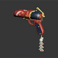 Decorative Toy Gun With Red Blue And Gold Accents Hanging Dice And Card Charms