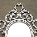 Ornate Gold Framed Oval Mirror Hanging On Gray Wall Reflecting Living Room Scene