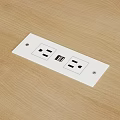 White Electrical Outlet Plate With Dual Power Sockets And USB Port On Wooden Surface