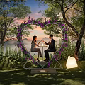Heart Shaped Floral Installation For Romantic Outdoor Garden With Couple Trees Sunset Sky And Lantern