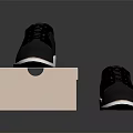 Black Leather Lace Up Shoes With White Soles On Brown Cardboard Box