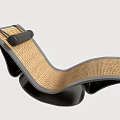 Modern Rattan Lounge Chair With Curved Black Frame And Woven Backrest