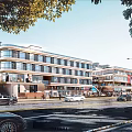 Vibrant Modern Commercial Street With Shops Cars Pedestrians And Lush Trees