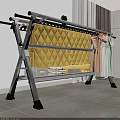 Metal Clothes Drying Rack With Yellow Quilt Pink Dress And Green Clothes Indoor