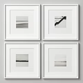 Four Black And White Framed Artworks Hanging On Minimalist Wall Decor