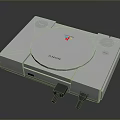 White Sony Classic PlayStation Console With Connected Cables And Vintage Design