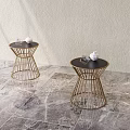 Modern Side Tables With Gold Metal Frame And Black Tabletop On Marble Floor