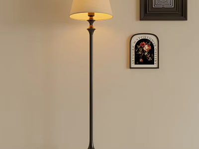 Illuminated Metal Floor Lamp with Light Colored Shade Beside Framed Wall Art on Beige Wall 3d model