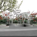 Modern White Pergola With Circular Canopy Metal Pillars And Greenery In Outdoor Park