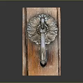 Antique Wooden Door Handle With Intricate Carved Floral Scroll Design On Wooden Base