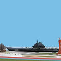 Scenic Coastal View With Naval Ship Orange Lighthouse And Sailboat Under Blue Sky