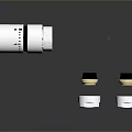 Metallic Transparent Cylindrical Components With Black Top Covers And Clear Bases
