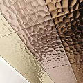 Textured Metallic Wall Decor With Geometric Patterns And Colorful Round Accents