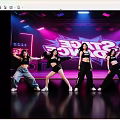 Women Dancing on Dance Stage with Neon Lights Wearing Black Tops and Various Pants