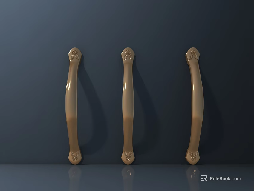 Three Golden Door Handles With Carved Decorations On Dark Gray Wall And Gray Countertop 3d model 