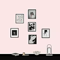 Wall Decor With Framed Artworks And Tabletop Items Lamp Books Candle And Decorative Bowl