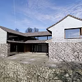 Traditional Homestay Building Exterior with Stone Wall Tile Roof Windows and Courtyard Entrance