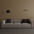 Three Seater Sofa With Beige Wall Floor Lamp Table Lamp On Side Table And Cushions