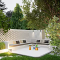 Beautiful Courtyard Garden With Green Lawn Stone Path Sofa Seating Lighting White Walls And Trees