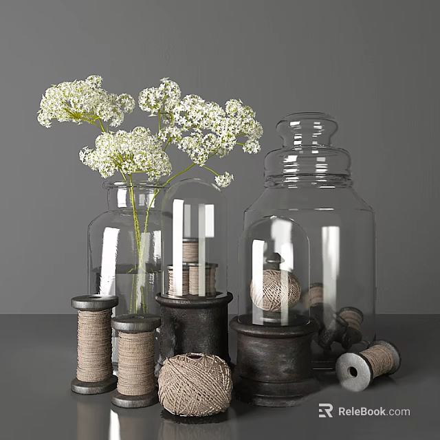 Decorative Ornament Set With White Flowers Clear Glass Vases And Twine Spools 3d model 
