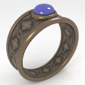 Elegant Vintage Ring With Blue Gemstone And Floral Patterned Metal Band