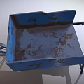Old Blue Rusty Wheelbarrow With Metal Bucket Handle And Single Wheel Design