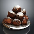 Stacked Golden Brown Fried Pastries Topped with Powdered Sugar on Silver Plate