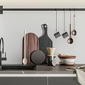 Modern Kitchen Counter With Hanging Metal Utensils Wooden Cutting Boards And Stacked Plates