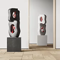 Contemporary Black and White Sculptures Featuring Red Musical Notes on Pedestals in Modern Interior