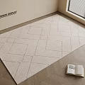 Square Rug With Geometric Pattern On Wooden Floor Near Open Book And Window