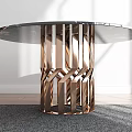 Round Coffee Table With Black Marble Top And Copper Geometric Base On Grey Rug