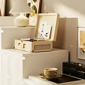 White Dresser In Bright Living Room With Sunlight And Decorative Items On Top