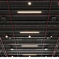 Black Ceiling With Red Pipes Linear And Round Lights And Vents
