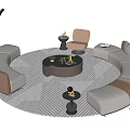 Elegant Circular Sofa and Coffee Table Set With Side Tables Armchair Floor Lamp and Patterned Rug