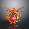 Golden Decorative Ornament With Intricate Wings And Circular Sphere Containing Pink Flame In Ornate Frame