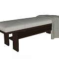 Modern Bed Bench With Light Upholstered Seat Dark Wooden Legs And Gray Throw Blanket